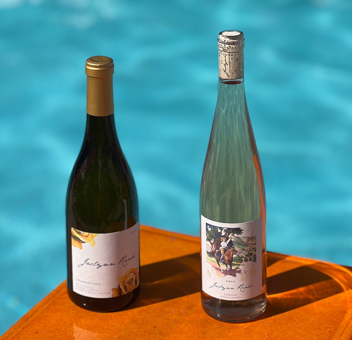 Summer-themed image of Jaclynn Renée Wines featuring their refreshing Rosé and Chardonnay, perfect for summer sipping, with a vibrant and inviting presentation that captures the light, crisp flavors ideal for warm weather enjoyment.