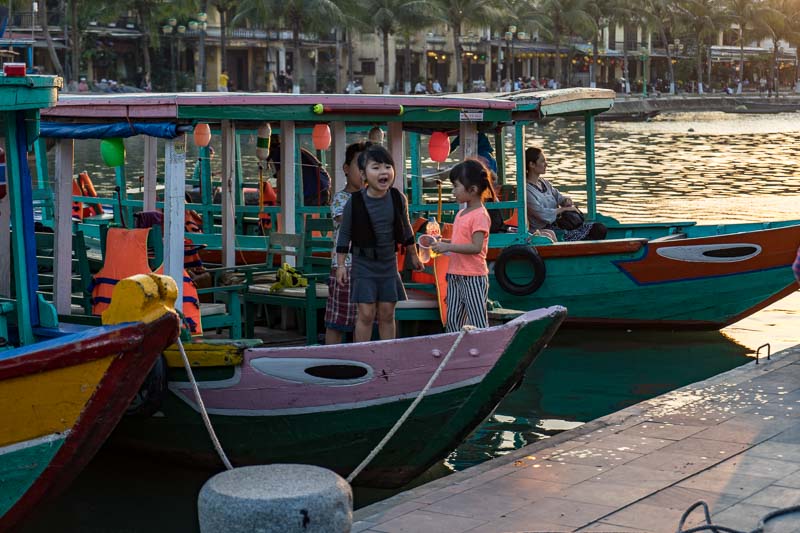 Children having fun on a tourist boat and Vietnam