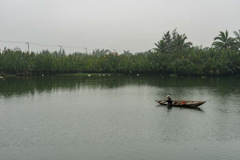 A man on a boat in Hoi-An Vietnam
