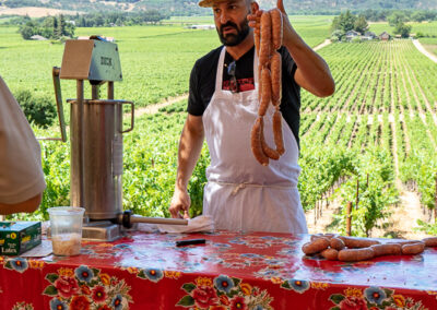 Dino of Diavola making sausage at Hawkes red winery vineyard