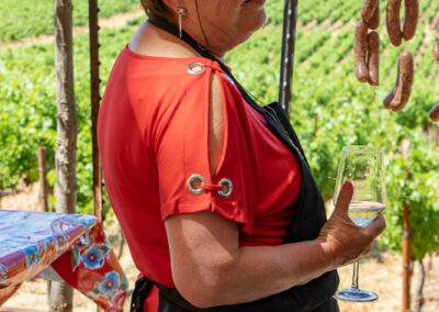 A woman enjoying the view and a glass of wine at Hawkes red winery Vineyard